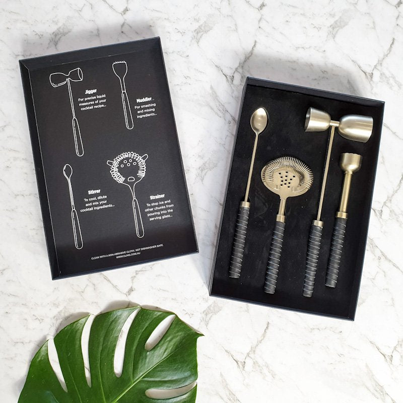 Clinq Brass Cocktail Kit with Leather Handles.
